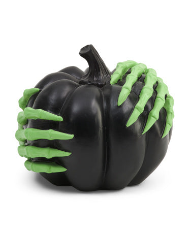 Witch hands holding a Black Pumpkin Halloween Home Decor